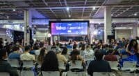 pessoas sentadas assistindo a um evento chamado bdxp